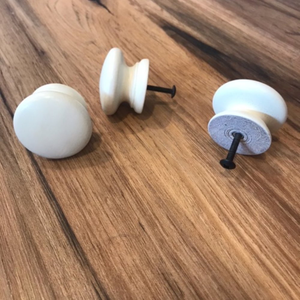 Whitewashed wooden door knobs